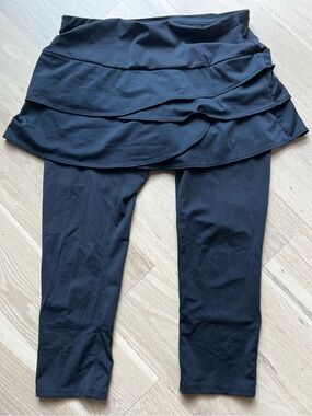 Lucky in Love Scallop Capri features a tiered ruffle skirt ankle length